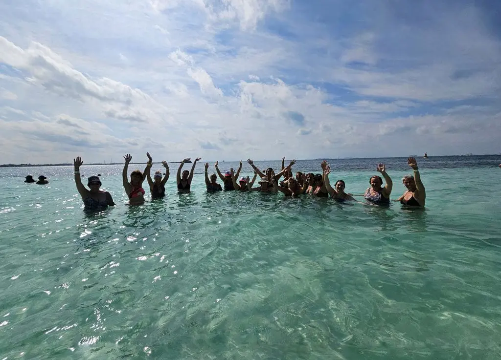 Women enjoying a wellbeing experience by the sea